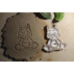 Duży wycinak + stempel do gliny / modeliny – siedzący dinozaur (10 × 10 cm)